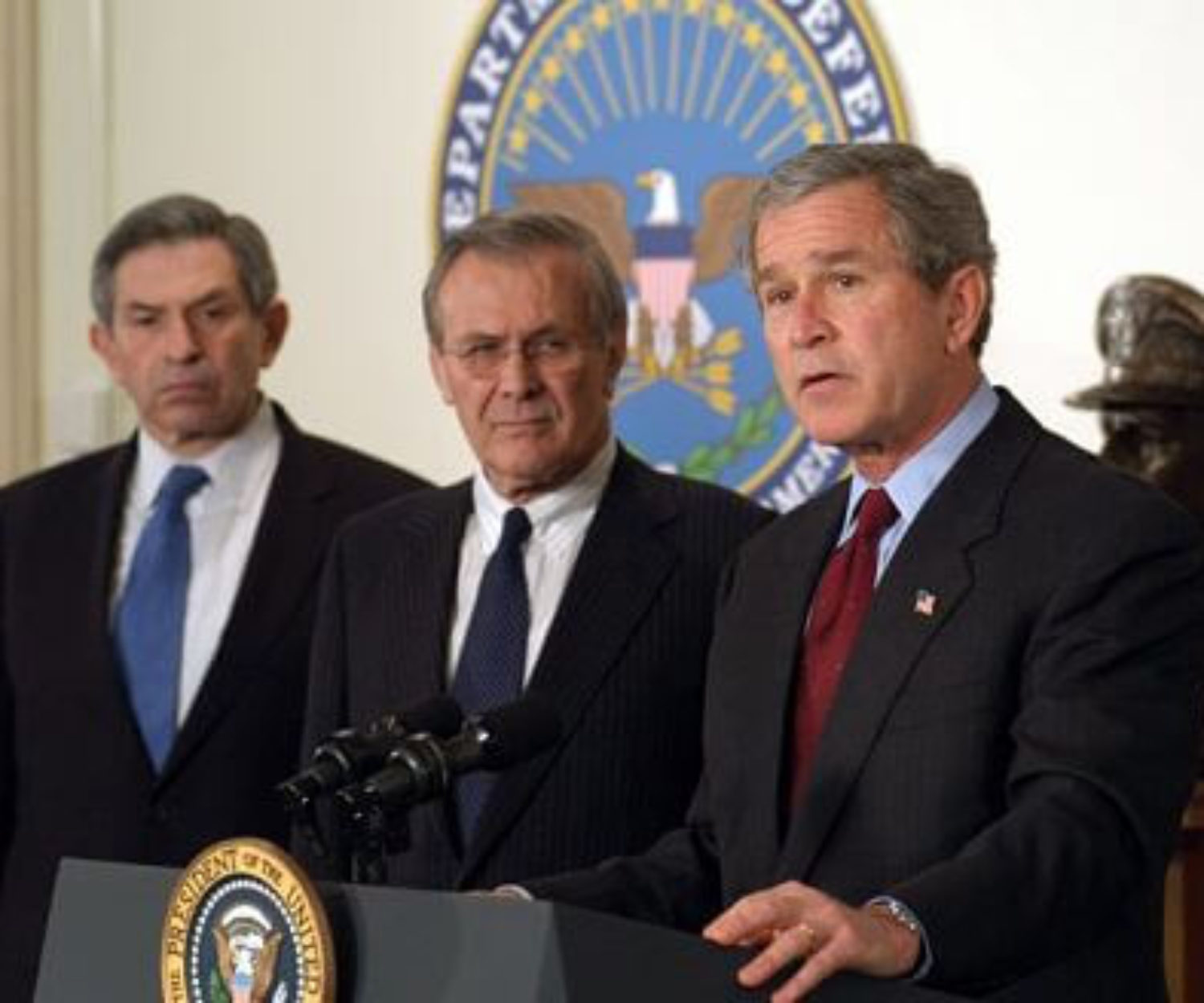 030325-D-9880W-079
President George W. Bush (right) announces his $74.7 billion wartime supplemental budget request in the Pentagon on March 25, 2003, as Secretary of Defense Donald H. Rumsfeld (center) and Deputy Secretary of Defense Paul Wolfowitz look on. Bush visited the Pentagon to meet with the senior defense leadership and to announce the supplemental request which, once appropriated by Congress, will pay for the direct costs of the Iraqi conflict and the global war against terror. DoD photo by R.D. Ward. (Released)