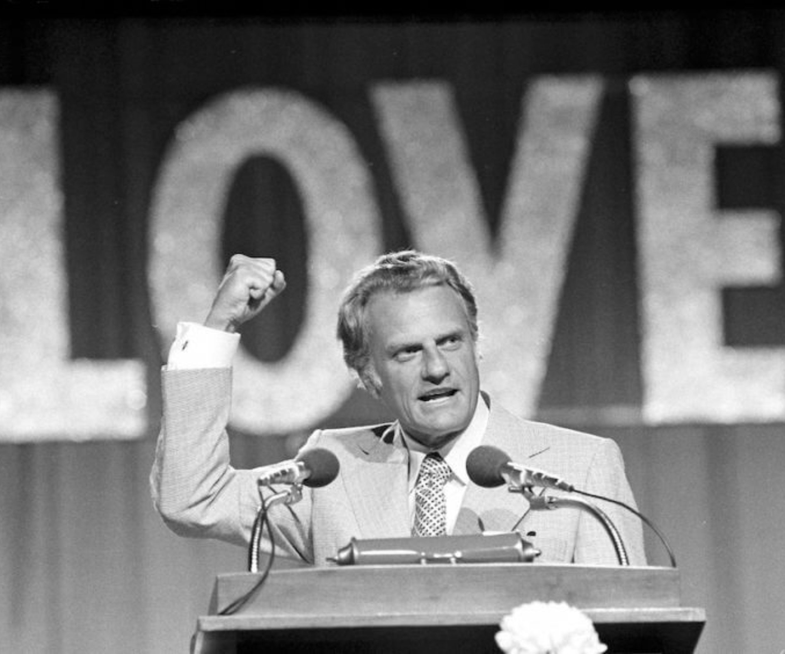 Evangelist Billy Graham speaks to 18,000 messengers in Dallas, June 13, 1974, on the closing night of the Southern Baptist Convention.  The theme of the convention was "Share His Love Now," and he asked the messengers to become "firebrands" for Christ, offering the gospel of Christ as the hope for the world.  (AP Photo)