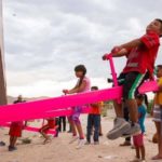 In Joyful Act of Resistance, Pink Seesaws Installed at Border Fence