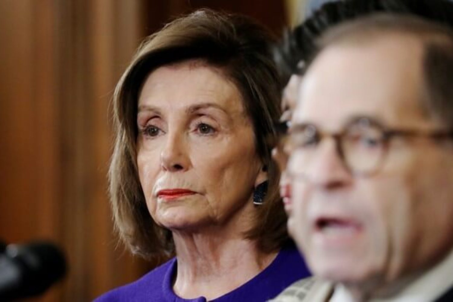 U.S. Speaker of the House Nancy Pelosi (D-CA) listens as House Judiciary Committee Chairman Jerrold Nadler speaks about articles of impeachment against Preisdent Donald Trump during a news conference with other Democratic committee chairs to announce articles of impeachment against the president on Capitol Hill in Washington, U.S., December 10, 2019. REUTERS/Jonathan Ernst - RC2ESD9I0Q6D
